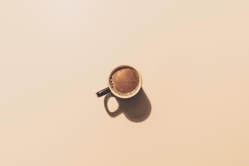 Image of coffee cup placed in the middle of the screen